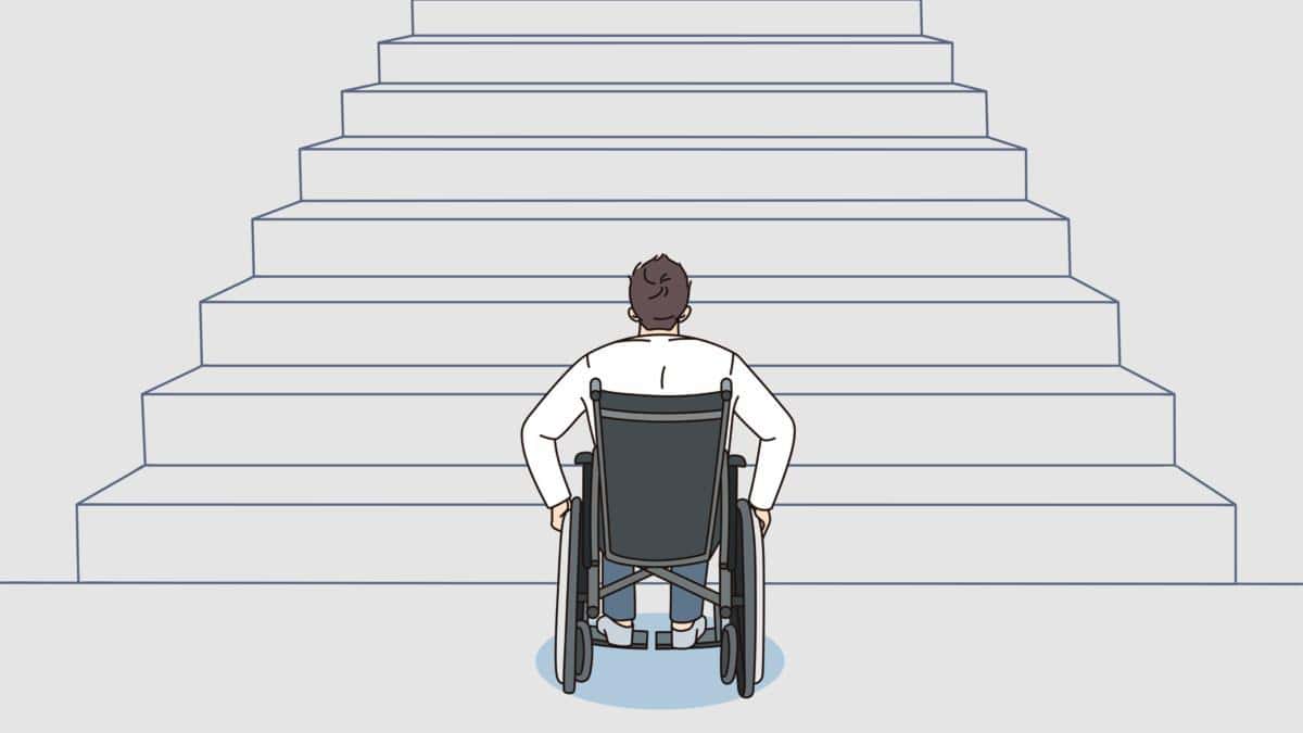 Dibujo donde aparece una persona en silla de ruedas frente a una escalera grande a la cual no puede acceder.