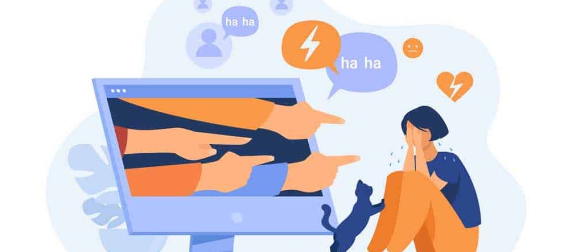 Ilustración donde aparece una mujer llorando y frente a ella una pantalla de un pc con muchas manos apuntandola e insultandola